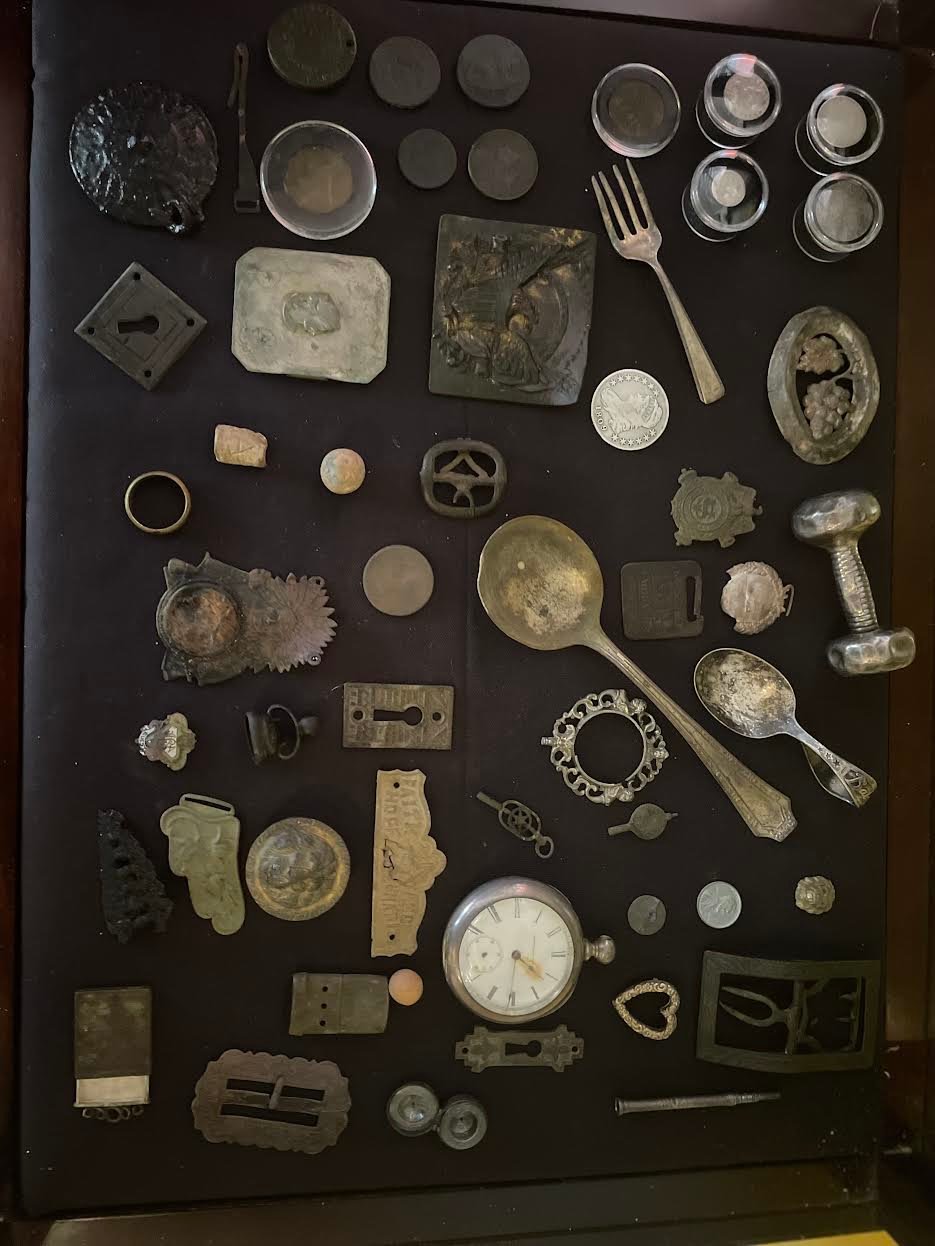 This chest inside his South Country Road home includes finds he has recovered from local homes including Brookhaven, Bellport and Bayport. The pocket watch dates back to 1867 and still has the original crystal and original hand. According to the Sears Roebuck, the pocket watch costs $25 and a good working man’s wage back then was about .50 cents a day. He found this on a private property in Bellport Village.